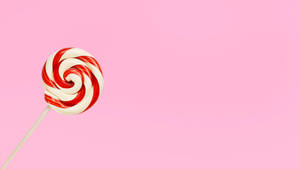 Red Candy On Pastel Pink Wallpaper