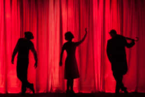 Red Curtain Silouette Acting Wallpaper