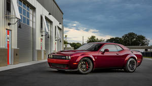 Red Dodge Challenger Demon 4k In Front Of A Building Wallpaper