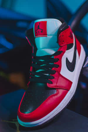Red Jordan Shoes Under Black Light Wallpaper