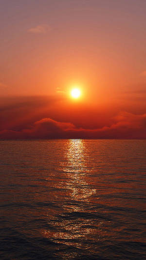 Red Sunset Sky Above Quiet Ocean Wallpaper