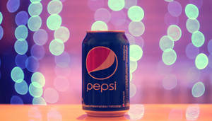 Refreshing Pepsi Drink Under Glittering Lights Wallpaper