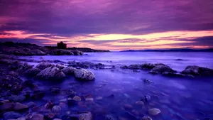 Relish The Vivid Beauty Of A Blue And Purple Sunset Wallpaper