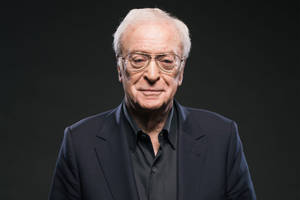 Renowned English Actor Michael Caine Exuding Elegance In Black Wallpaper