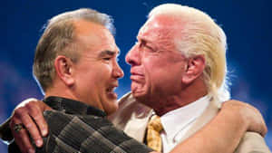 Renowned Wrestlers Ric Flair And Ricky Steamboat Sharing A Moment Wallpaper