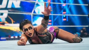 Rhea Ripley Wrestling Match Victory Gesture Wallpaper