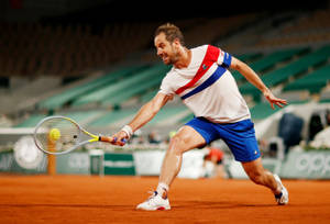 Richard Gasquet Bending To Reach Ball Wallpaper