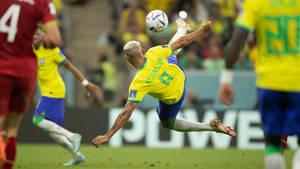 Richarlison De Andrade Kicking Football Wallpaper