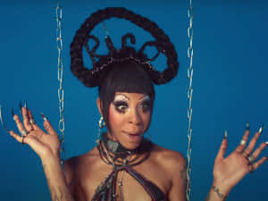 Rico Nasty Showing Her Unique Style In A Colorful Stage Outfit. Wallpaper