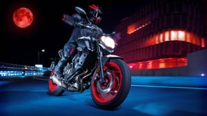 Rider With Black Yamaha Mt 15 Under The Red Moon Wallpaper