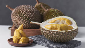 Ripe Durian Fruits With Pulps On Table Wallpaper