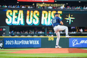 Robbie Ray In Pitching Position During A Match Wallpaper