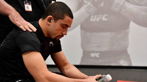 Robert Whittaker Sitting With Eyes Closed Wallpaper