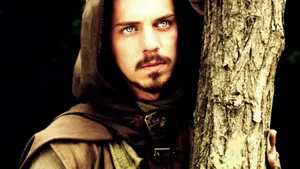 Robin Hood Peeking From Tree Wallpaper