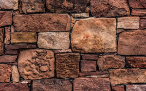 Robust And Aesthetic Brown Stone Wall Wallpaper