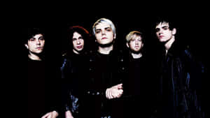 Rock_ Band_in_ Black_ Attire_ Group_ Photo Wallpaper