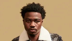 Roddy Ricch Performing On Stage Wallpaper