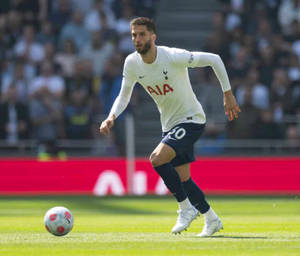 Rodrigo Bentancur Chasing Football On Field Wallpaper