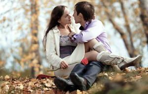 Romantic Couple Autumn Leaves Wallpaper