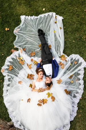 Romantic Couple Wedding Clothes On Ground Wallpaper