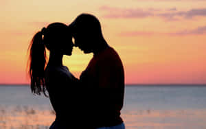 Romantic Silhouette Sunset Hug Wallpaper