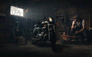 Royal Enfield Hd Man At Work Wallpaper