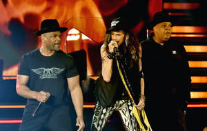 Run D.m.c And Aerosmith Collab Concert Wallpaper