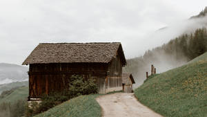 Rural Houses On Mountain Slope Wallpaper