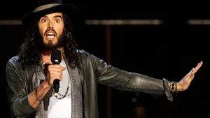 Russell Brand Comedian On Stage Wallpaper