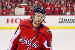 Russian Professional Hockey Star, Evgeny Kuznetsov In Action Wallpaper