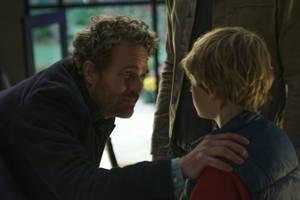 Ryan Reynolds In The Adam Project Interacting With His Young Self. Wallpaper