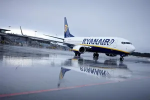 Ryanair Airplane On Wet Runway Wallpaper