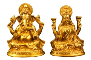 Sacred Golden Figurines Of Ganesh And Lakshmi Wallpaper