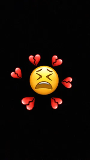 Sad Emoji Amidst Broken Heart Iphone Wallpaper