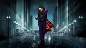 Sad Joker Walking With A Card Wallpaper