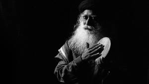 Sadhguru Playing A Kanjira Black And White Wallpaper