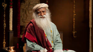 Sadhguru Sitting And Smilling Wallpaper