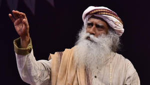 Sadhguru With A Raised Hand Wallpaper