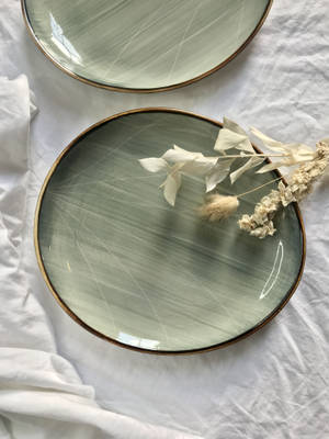 Sage Green Plates And Dried Flowers Wallpaper