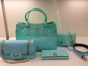 Salvatore Ferragamo Turquoise Bag Set Showcasing Elegance And Luxury Wallpaper