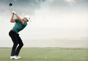 Sam Burns Preparing To Strike Golf Ball Wallpaper