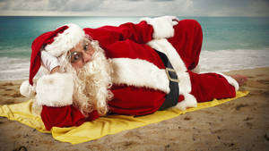Santa Claus In The Beach Wallpaper