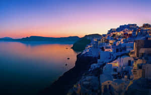 Santorini Sunset Glow Wallpaper