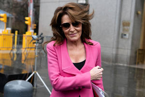 Sarah Palin Donning A Professional Pink Suit. Wallpaper