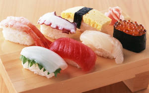 Sashimi And Sushi On Serving Board Wallpaper