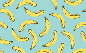 Scattered Bananas On Teal Wallpaper