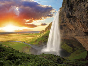 Scenic View Of Serene Waterfall Wallpaper