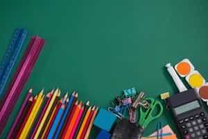 School Supplies On A Green Background Wallpaper