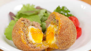 Scotch Egg Runny Yolk And Vegetable Salad Wallpaper