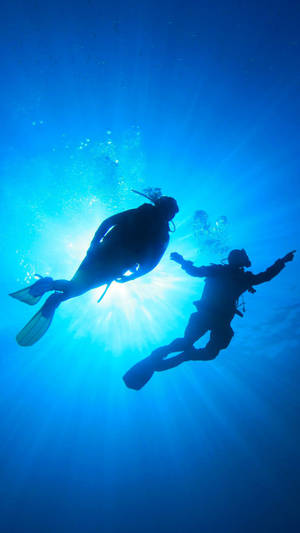 Scuba Diving Silhouettes Wallpaper